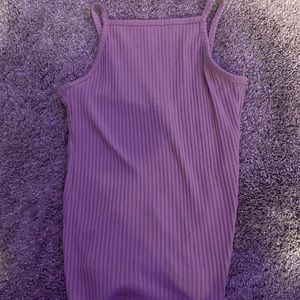 Nothing is wrong with this tank it’s cute the color is like a tan/mov.